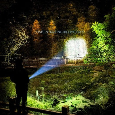Rechargeable LED Flashlight lighting up the forest